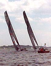 Alinghi and Oracle going south in Newport.