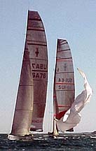 Oracle and Alinghi coming into downwind mark, Newport